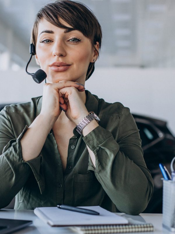 Young woman with microphone in studio